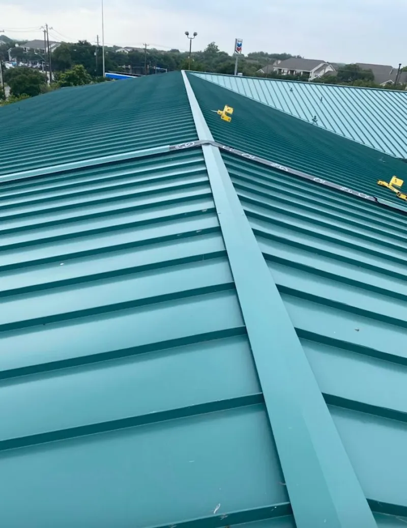 Green commercial metal roof ridge and valley for Metal Roof Repair in Galveston